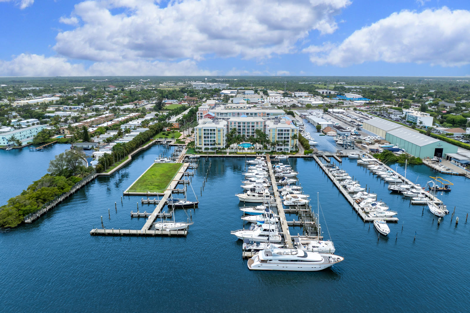 Waterfront property with marina and boat docks in Lantana, Florida, captured by drone