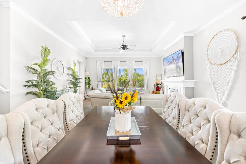 Luxury primary bedroom with crystal chandelier in a Palm Beach County estate
